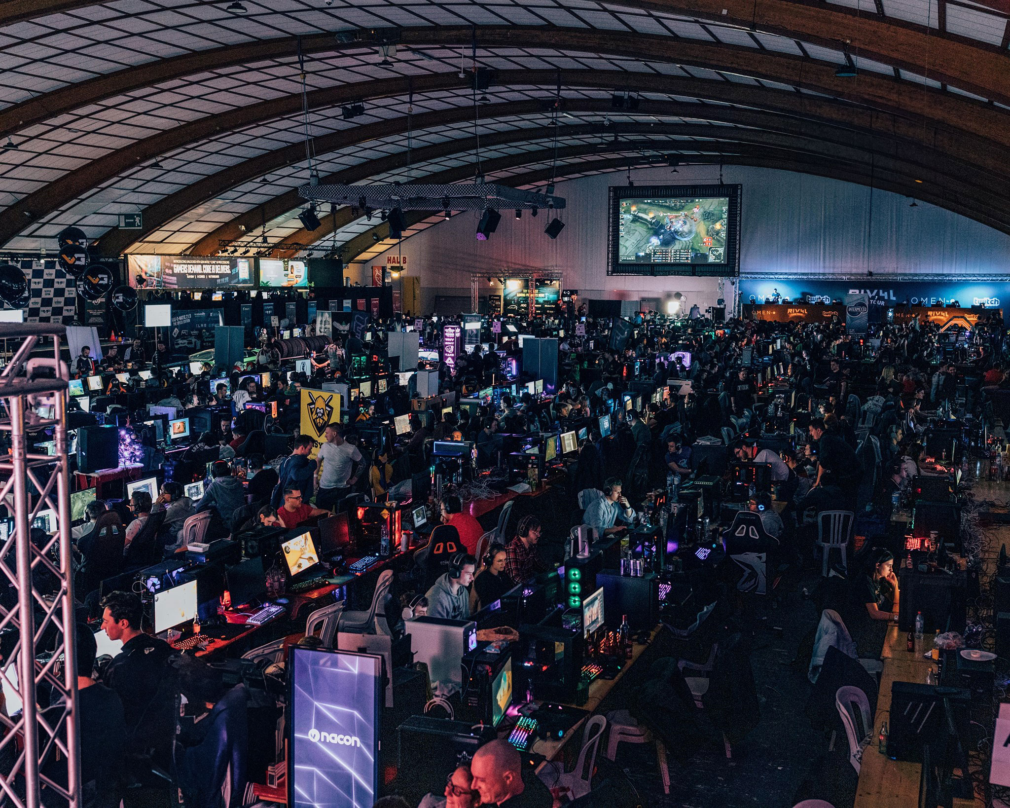 Frag-o-Matic: an illuminated event hall filled with gamers and their computers